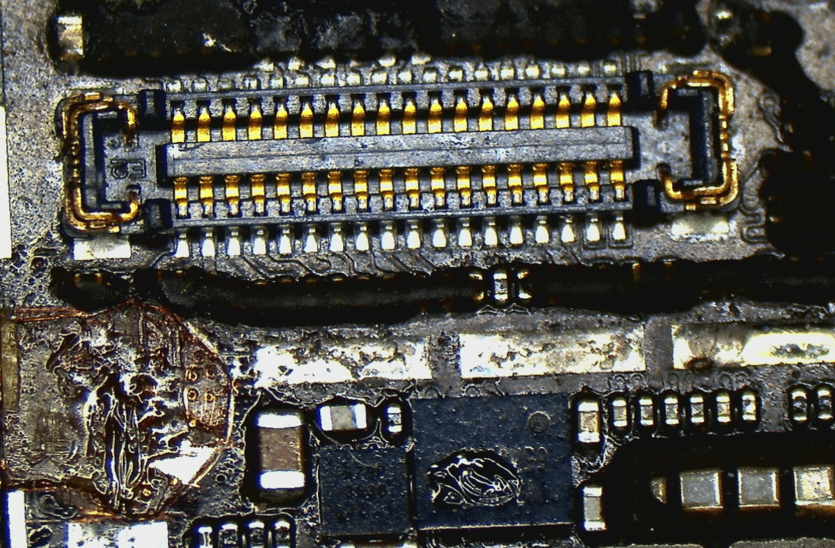 Long screw damage close-up showing cut inner layers by the standoff