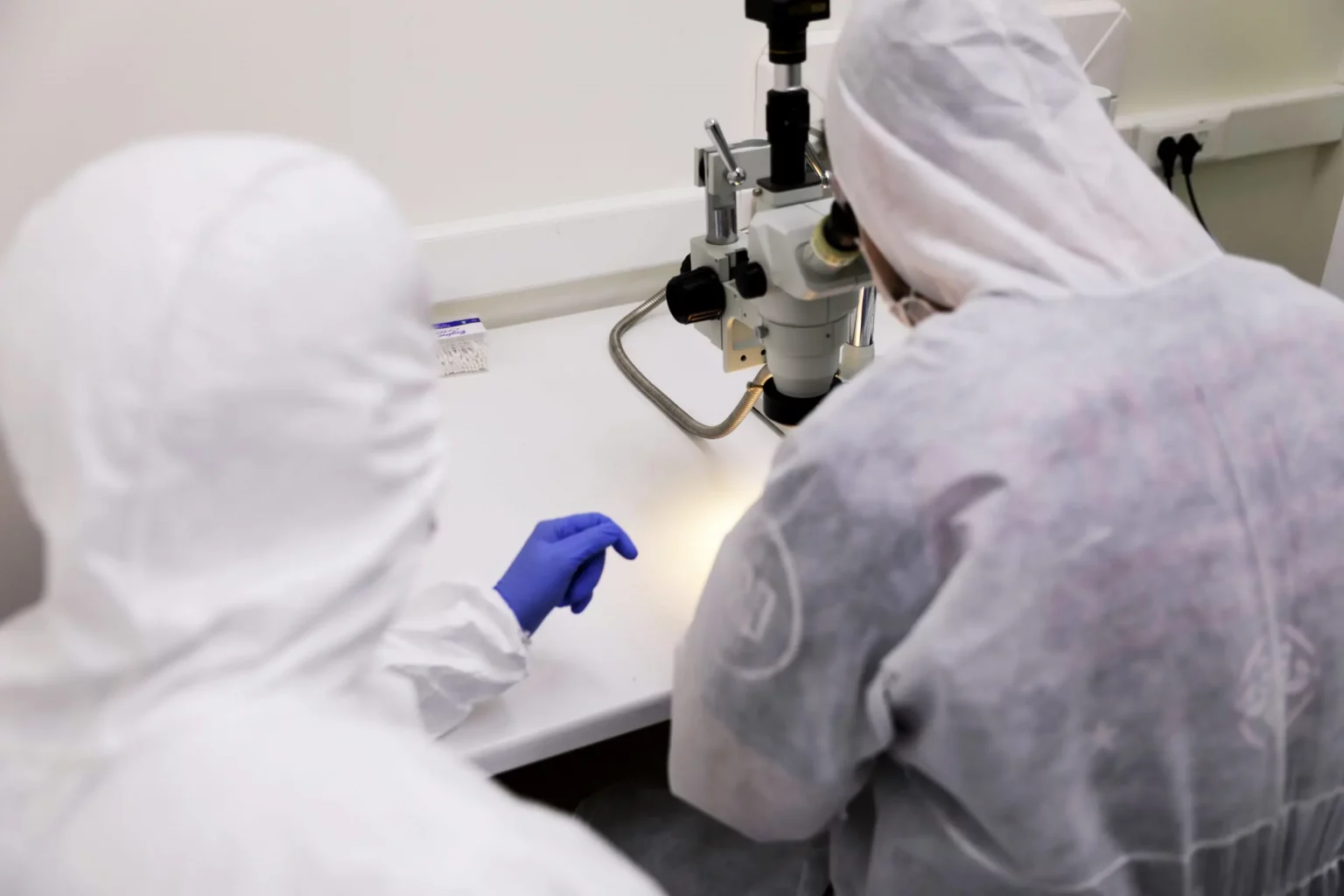 Technicians in full clean‑room suits at PITS Data Recovery